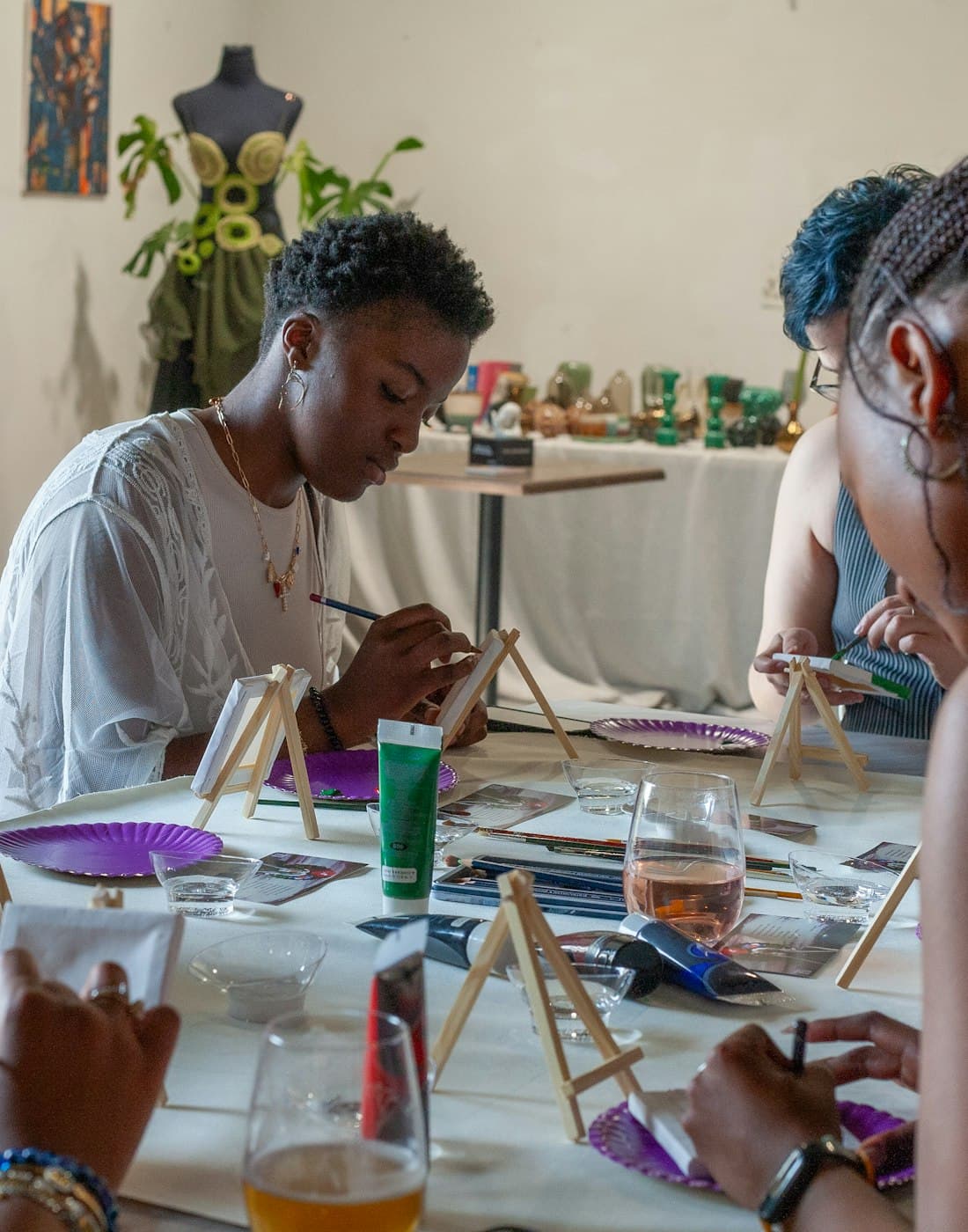 People creating colourful art at a Pink Pune workshop